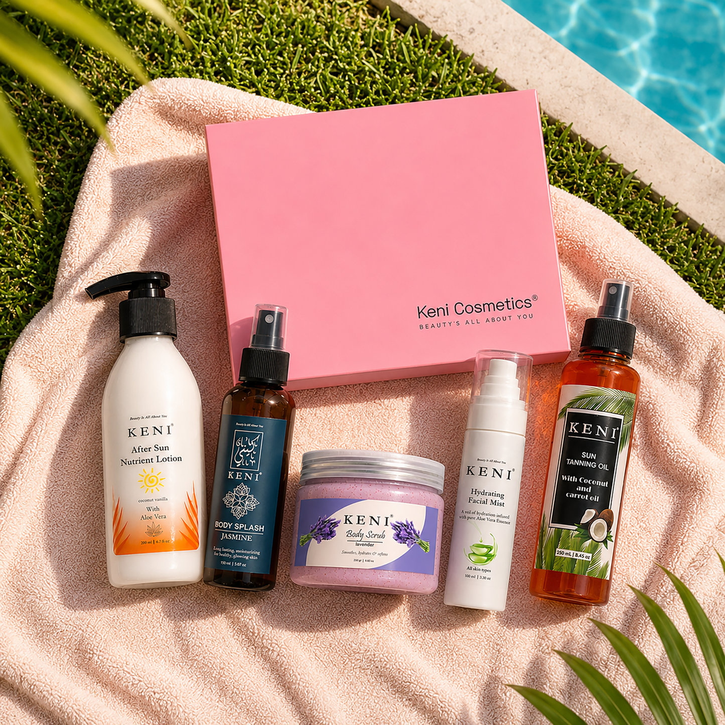 Keni Cosmetics skincare products summer essential box including bottles and a jar on a towel by a poolside.