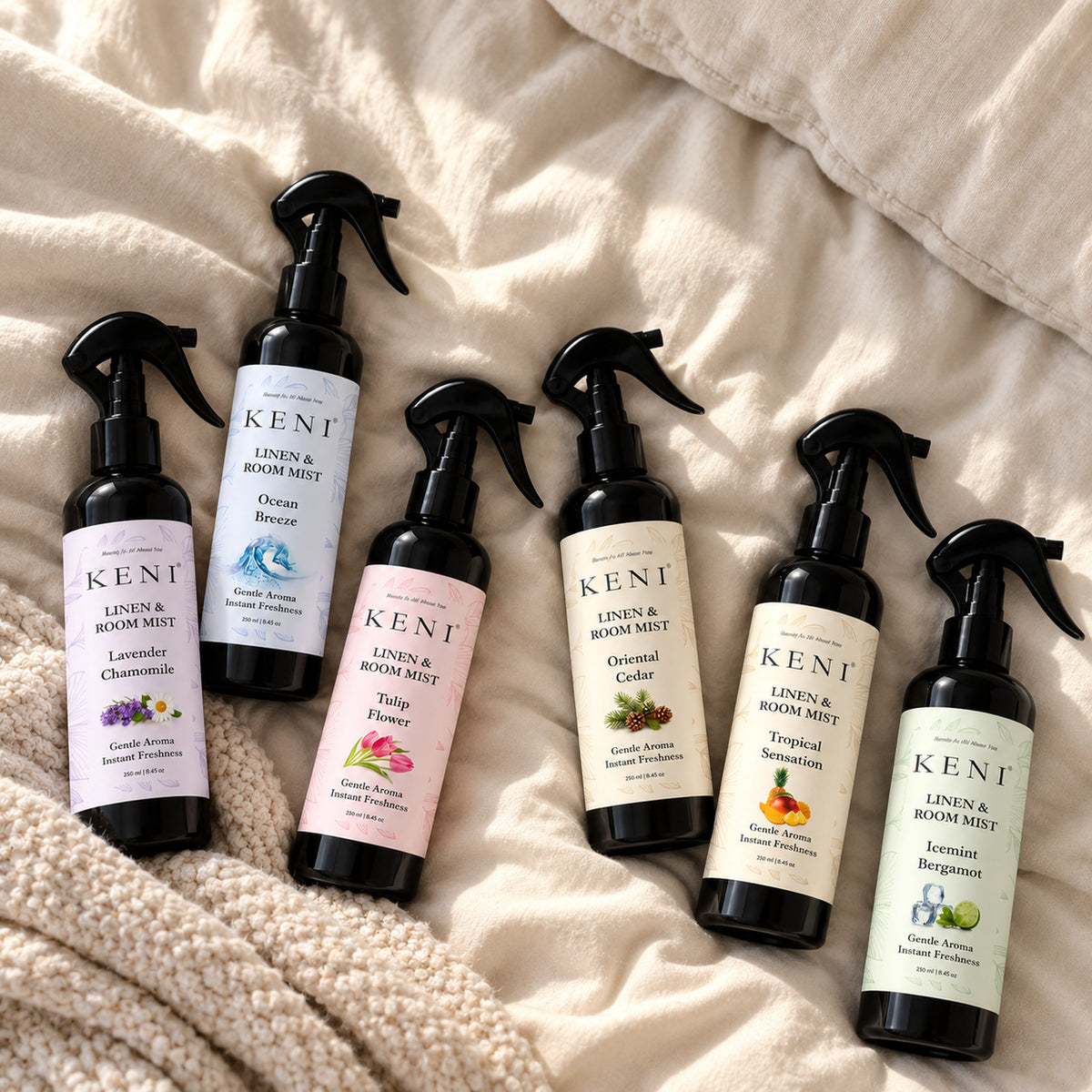 Six KENI Cosmetics linen and room mist scents in black spray bottles, available in Lebanon